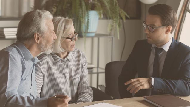 Elderly couple meeting with an advisor