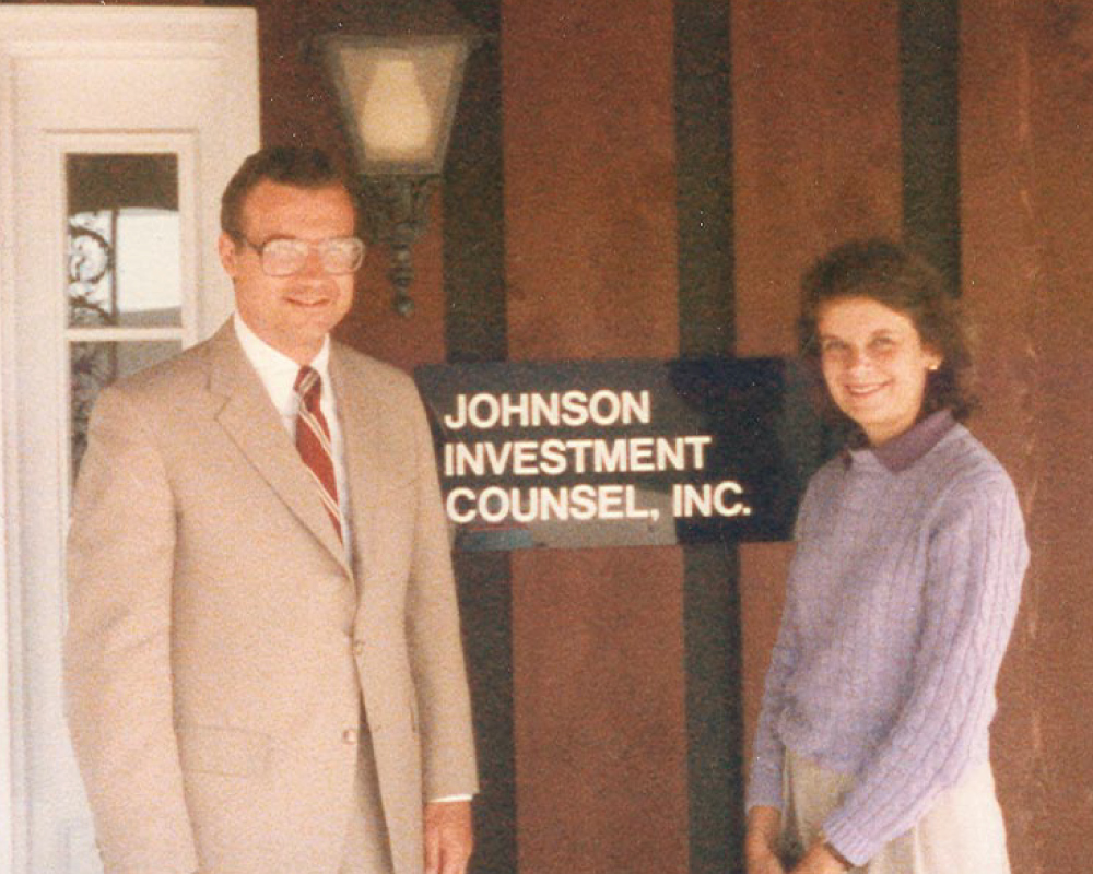 Tim and Janet Johnson outside the first JIC office in West Fork.